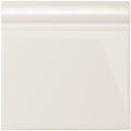 Vintage white skirting tile featuring cream-colored glossy ceramic baseboard trim for elegant wall finishing