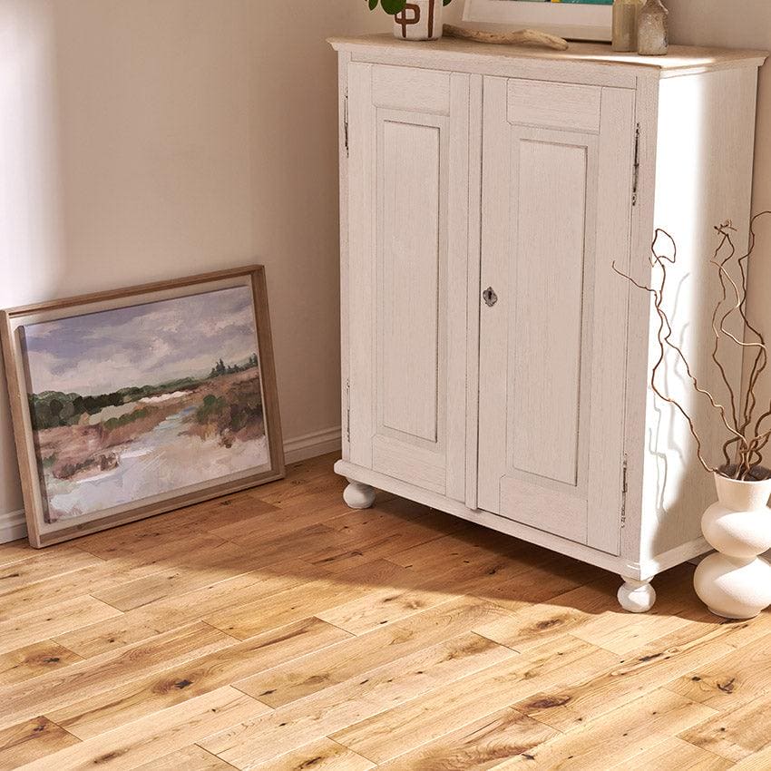 White painted wooden cabinet with two doors and round feet from york rustic oak collection
