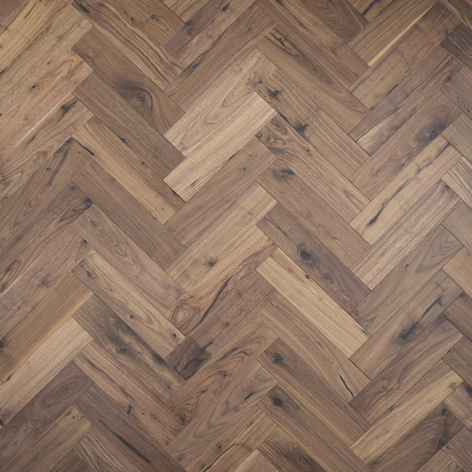 Dark walnut hardwood flooring zb205 black walnut arranged in a herringbone pattern showcasing rich wood texture
